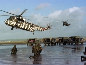 Helo's from 845 Squadron arrive with more troops, during an amphibious exercise at the 'Amphibious Trials and Training Unit Royal Marines' beach which is near Barnstable, Devon.