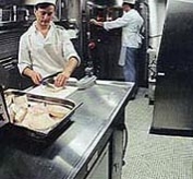 A Chef preparing food on board a nuclear submarine