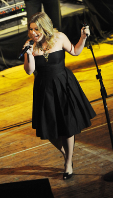 Kelly Clarkson performs as part of a celebration of Reba McEntire's career in 2008. 