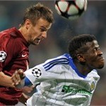 Sergei Semak (L) of FC Rubin Kazan fights for a ball with Ayila Yussuf  of FC Dynamo Kiev