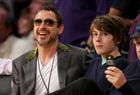 Robert Downey Jr. (L) and his son Indio Downey (R) attend the Los Angeles Lakers against Utah Jazz playoff game at the Staples Center
