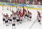 In this file photo, Sidney Crosby of  Canada celebrates with his team after winning the gold  medal in hockey by defeating the U.S. at the Vancouver 2010 Winter Olympics.