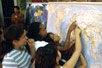 Photo: Children looking at a map