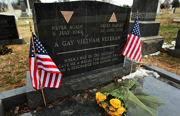 Two American flags and a bouquet of flowers are placed on the gravesite of Sgt. Leonard Matlovich, at Congressional Cemetery on December 22, 2010 in Washington, D.C. Sgt. Matlovich, who died in 1988, was a Vietnam Veteran who received both the Purple Heart and Bronze Star and was later discharged from the Air Force for being gay. An inscription on his tombstone reads "When I was in the military, they gave me a medal for killing two men and a discharge for loving one". Earlier today U.S. President Barack Obama signed into law a bill repealing the "don't ask, don't tell" law against gays serving in the military.