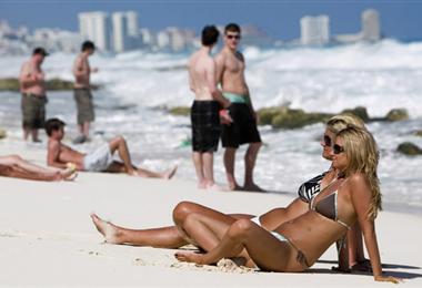 Tourists rest at Cancun beach in the Mexican state of Quintana Roo