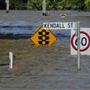 Street signs submerged in flood waters are seen in Kendall Street in Bundaberg, Queensland, Australia on December 31.