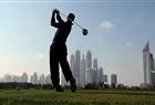 Tiger Woods plays a shot during the first round of the Dubai Desert Classic golf tournament in the Gulf emirate on February 10, 2011.