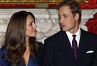 Britain's Prince William and his fiancee Kate Middleton (L).