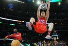 Blake Griffin from the L.A. Clippers slam dunks a ball over a car as teammate Baron Davis looks on, before winning the All-Stars Slam Dunk contest at the Staples Center in Los Angeles on February 19, 2011.