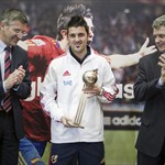 Spanish National team striker David Villa (C) receives from hands of Royal soccer Federation chairman Angel Maria Villar (R) and Adidas chairman Herbert Hainer (L) the Silver Boot