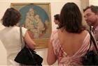 Visitors look at the works by Jean-Auguste-Dominique Ingres