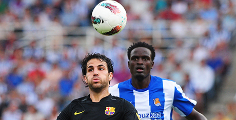 Photo | AFP  Barcelona’s Cesc Fabregas (left) vies for an aerial ball with McDonald Mariga of Real Sociedad during their Primera Liga match in San Sebastian, on Saturday. They drew 2-2. 