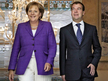 Russia Federation, Sochi: Russian President Dmitry Medvedev (R) meets with German Chancellor Angela Merkel in Sochi on August 14, 2009 (AFP Photo / Dmitry Astakhov)