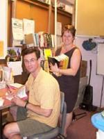 Chuck Palahniuk signs books at St. Helen's Book Shop, with Luanne Kreutzer.