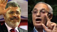 Die zwei Erstplatzierten in Ägypten gehen in die Stichwahl: Mursi (links) und Schafik  (Foto: dpa)