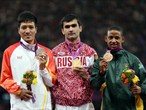 Gocha Khugaev of Russia poses with his gold medal