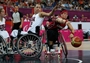 Cindy Ouellet of Canada and Alana Nichols of the United States reach for the ball 