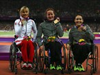 Silver medallist Edith Wolf of Switzerland, gold medallist Tatyana Mcfadden of the United States and bronze medallist Shirley Reilly of the United States pose on the podium 