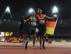 Gold medallist Heinrich Popow of Germany and silver medallist Scott Reardon of Australia celebrate 