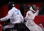Gyongyi Dani of Hungary and Wu Baili of China compete during the women's team Wheelchair Fencing