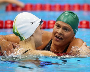 Ellie Cole of Australia is congratulated by Natalie du Toit of South Africa 