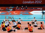 Brazil attempt a block during the men's Sitting Volleyball