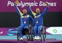 Peter Vikstrom and Stefan Olsson of Sweden celebrate with their gold medals 