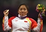 Gold medallist Zhou Hongzhuan of China poses on the podium