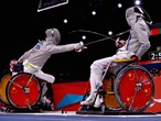 Chen Yijun of China and team mate Tian Jianquan compete in the men's Individual Sabre Wheelchair Fencing