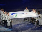 The Paralympic flag is carried into the stadium
