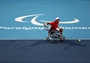 Shingo Kunieda of Japan in action against Stephane Houdet of France in the men's Wheelchair Tennis 