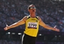 Ruslan Katyshev of Ukraine celebrates a jump as competes in the men's Long Jump - F11 final 