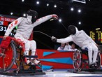 Hu Daoliang of China competes against Alim Latrech of France 