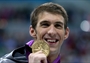 Michael Phelps poses with his 200m Individual Medley gold medal