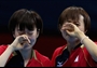 Kasumi Ishikawa and Sayaka Hirano of Japan celebrate