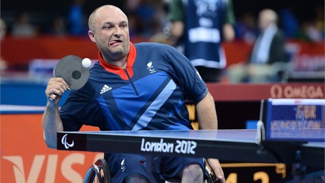 Scott Robertson of Great Britain competes against Cao Ningning of China 