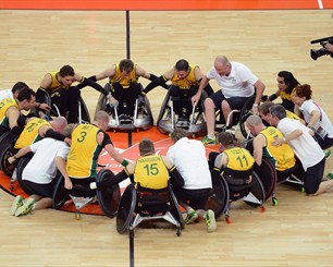 A victorious team huddle for Australia's Wheelchair Rugby team