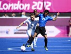 James Richard of Great Britain is tackled by Matias Fernandez Romano of Argentina 