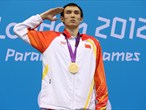 Yang Bozun of China salutes on the podium