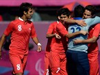 Farzad Mehri of the Islamic Republic of Iran celebrates with his team-mates 