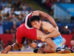 Tatsuhiro Yonemitsu of Japan in action against Sushil Kumar of India