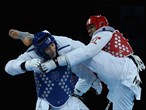 Daba Modibo Keita of Mali competes against Akmal Irgashev of Uzbekistan