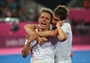 Benjamin Wess of Germany is embraced by a team mate as he realises victory