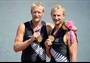 Eric Murray and Hamish Bond of New Zealand celebrate with their gold medals 