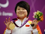 China's Zhang Cuiping with her third medal of the Games