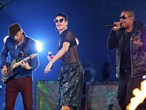 Jay-Z and Rihanna perform with Will Champion of Coldplay