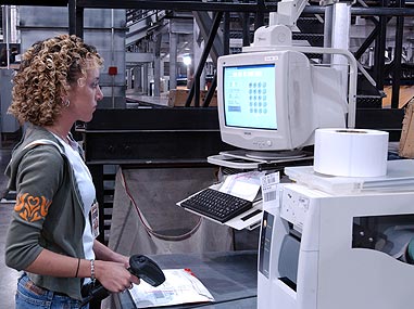 Employee working at UPS Worldport computer station