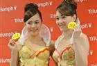 Japanese models Arisa Watanabe (L) and Alisa display the new bra “Branomics Bra” inspired from Japanese Prime Minister Shinzo Abe’s economic policy “Abenomics” at a press preview in Tokyo on May 8, 2013. The bra has three toy arrows and a target shaped pouch to represent Abe’s “three arrows” economy stimulation package.