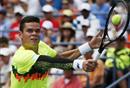 Milos Raonic of Canada returns a shot against Victor Estrella Burgos of Dominican Republic during the third round of the 2014 U.S. Open tennis tournament on Saturday in New York.