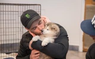 Gus Kenworthy reunites with his dog Beemo, a dog he rescued from a dog meat farm in South Korea, at the SPCA Montreal Annexe, in Montreal, Quebec